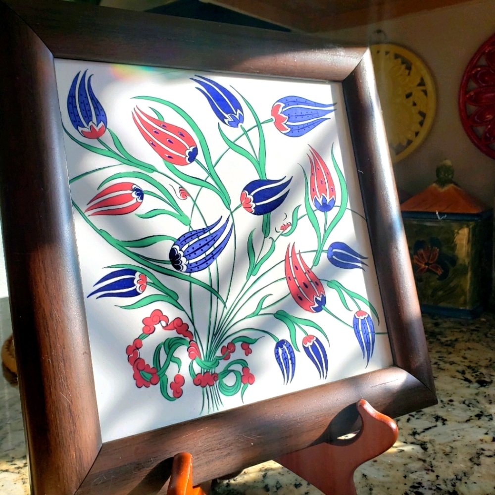 Floral tile in wooden frame